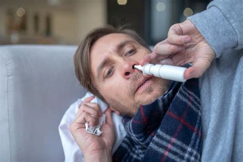 Top View Of Sick Exhausted Man Using Nasal Spray Stock Photo Image Of