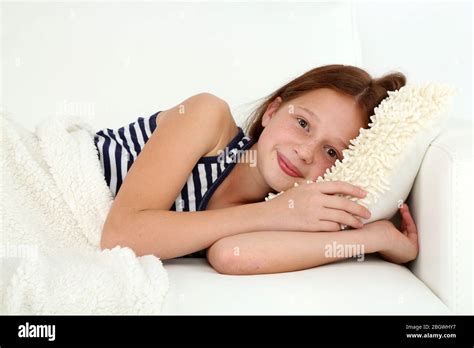 Beautiful Little Girl Lying On Sofa In Room Stock Photo Alamy