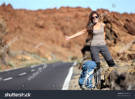 Travel Woman Hitchhiking Beautiful Young Female Hitchhiker By The Road During Vacation Trip On