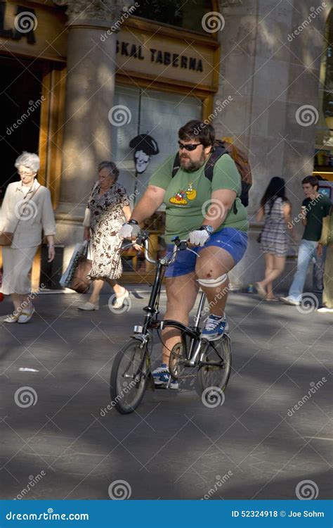 Overweight Man Riding Bicycle On Passeig De Gr Cia In The Eixample