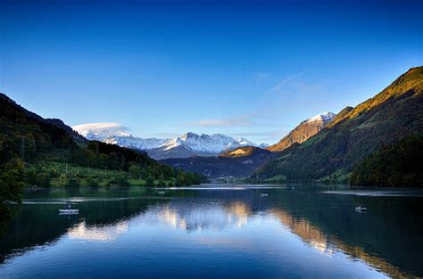 Lake Lungern With Snow Mountain View In Lungern Switzerland Stock Photo - Download Image Now ...