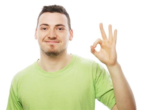 Premium Photo Young Man In Green Shirt Showing Thumbs Up