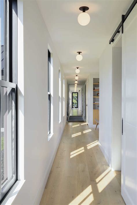 Separate Living Areas Of This Home Are Connected By A Central Hallway