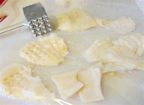 Tenderizing The Raw Conch Abaco Sun