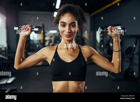 Positive Delighted Brunette Woman Posing On Camera Stock Photo Alamy