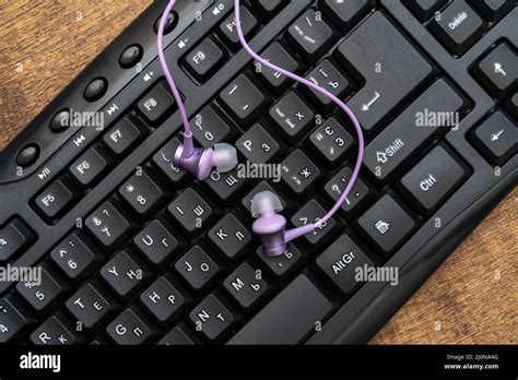 Computer Keyboard And Earphones Stock Photo Alamy