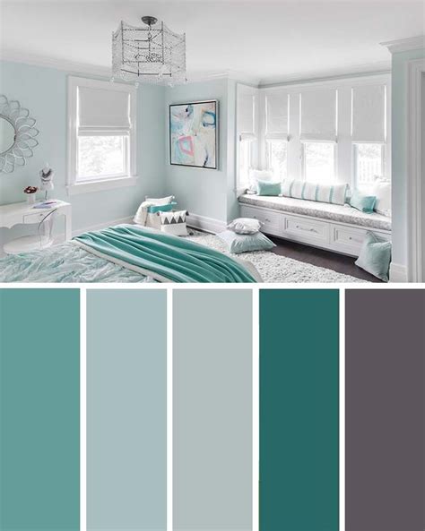 A Bedroom With Blue And Green Walls White Furniture And Pillows On