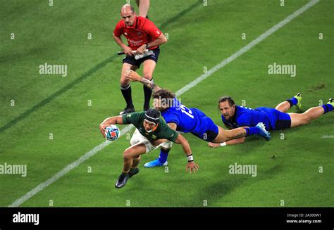 South Africa's Cheslin Kolbe (centre) scores his side's first try of ...