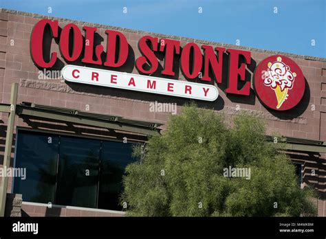 A Logo Sign Outside Of The Headquarters Of Cold Stone Creamery In