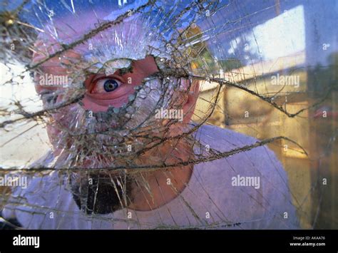 Man Looking Through Broken Glass Window Stock Photo Alamy