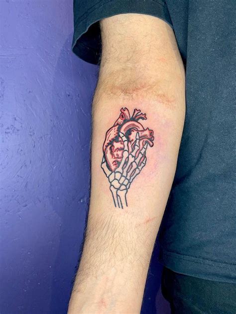 Skeleton hand holding heart by S Darko (Sheffield UK) : r/tattoos