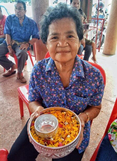Premium Photo Portrait Of Smiling Mature Woman Holding Religious