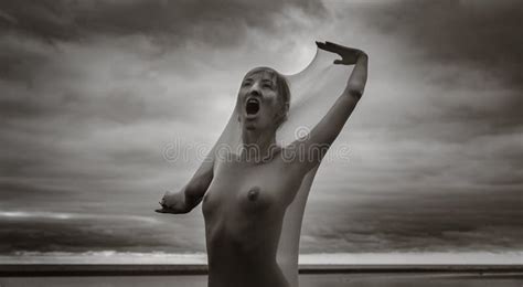 Womans Cry Nude Woman In Transparent Fabric On The Beach Stock Image