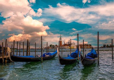 Gondolas On Canal And Basilica Santa Maria Della Salute Venice Italy