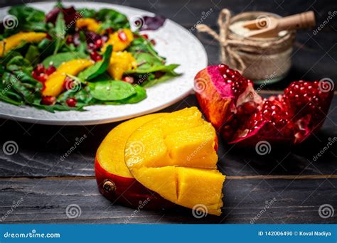 Close Up View Of Home Made Mango Fruit Salad Pomegranate Lettuce And