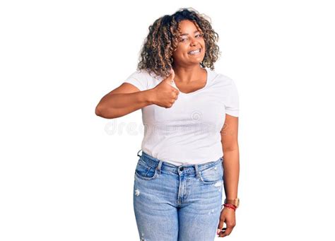 Young African American Plus Size Woman Wearing Casual Clothes Doing