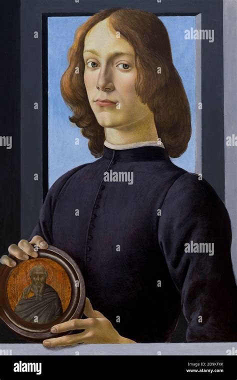 Portrait Of A Young Man Holding A Medallion Sandro Botticelli Circa