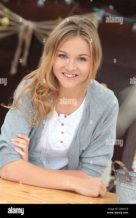 Smiling Woman Leaning On Bar Table Stock Photo Alamy