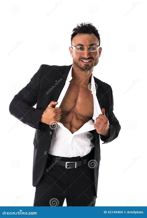 Businessman Opening His Shirt Revealing Muscular Torso Stock Photo