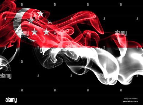 National Flag Of Singapore Made From Colored Smoke Isolated On Black Background Abstract Silky