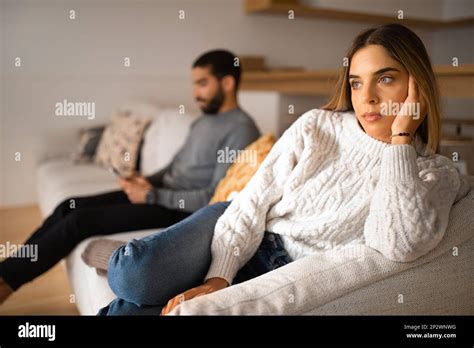 Unhappy Millennial Arabic Husband Plays In Game On Smartphone Ignores European Wife In Room