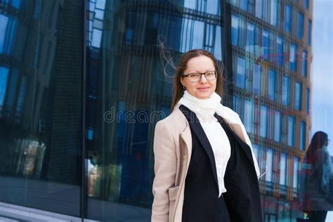 Female Portrait Of A Business Woman Wearing Glasses At The Business