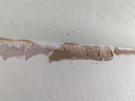 How to remove this solid, plastic like, adhesive? : r/DIYUK