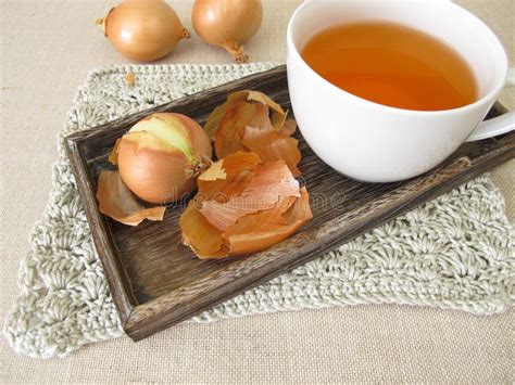 A cup of onion peel tea stock photo. Image of brown - 237768114