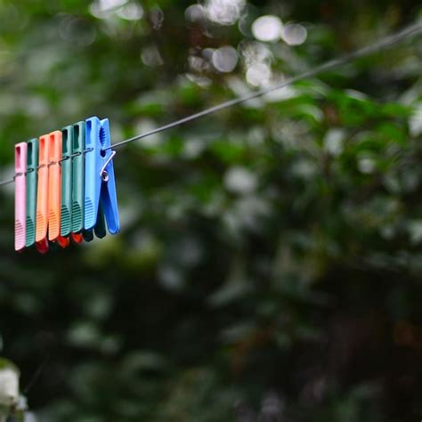 Premium Photo Close Up Of Clothes Drying On Rope