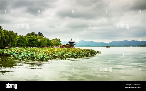 Jixian Pavilion At West Lake Under Cloudy Sky Hangzhou Stock Photo Alamy