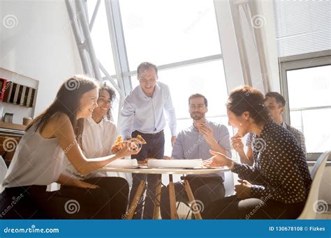 Cheerful Diverse Team People Laughing At Joke Eating Pizza Toget