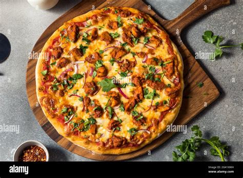 Homemade Indian Chicken Tikka Masala PIzza With Onions And Cilantro