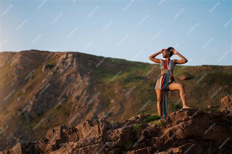 Premium Photo | Woman wearing native african clothing on mountain