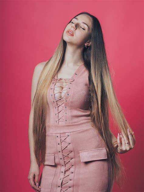 Brunette Girl Posing At The Pink Background Stock Image Image Of