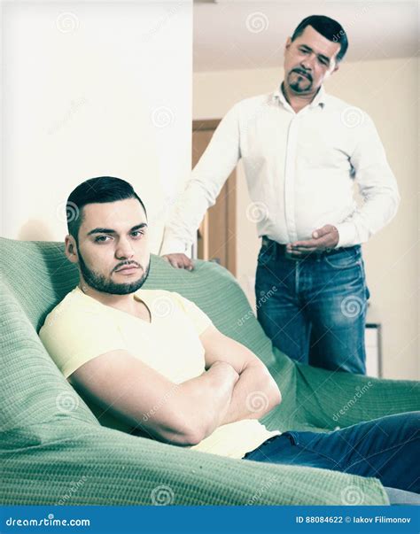Domestic Quarrel Between Men Stock Photo Image Of Mature Couch