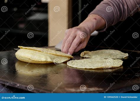 Mexican Fresh Corn Tortillas Being Cooked On A Traditional Comal