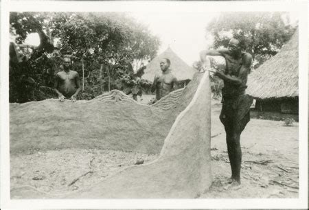 Building Clay Wall Of Zande Hut From The Southern