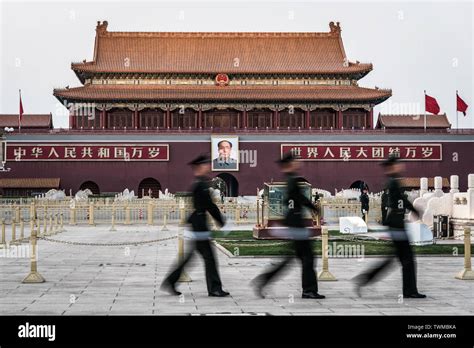 March Guards Walking In Front Of A Giant Portrait Of Mao