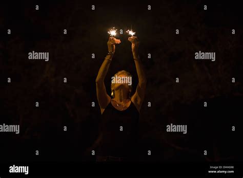 Mature Woman With Sparklers At Night On Independence Day Destin Florida Usa Stock Photo Alamy