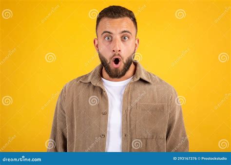 Shocked Millennial Caucasian Guy With Beard In Casual With Open Mouth