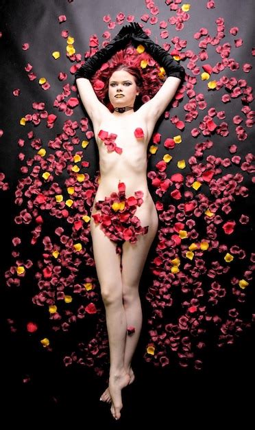Premium Photo Full Length Of Sensuous Naked Woman Covered With Rose Petals While Lying Down On Bed