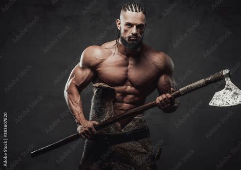 Brutal Bodybuilder In Fashion Of Ancient Furios Viking Posing With