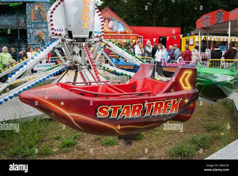 Fairground roundabout Star Wars rocket ride with red Star Trek ...