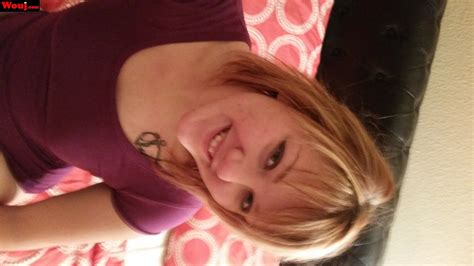 Cute Blonde Girl Loves Posing Fully Clothed On The Bed Photos