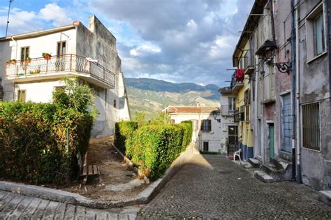 Premium Photo | A street between the old stone houses of Pratola Peligna a medieval village in ...