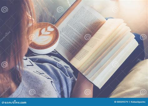 Soft Photo Of Young Girl Reading A Book And Drinking Coffee Top Stock Image Image Of Coffee