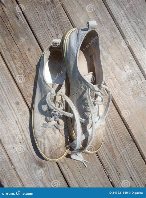 Old Worn Out and Dirty White Sneakers Stock Photo - Image of sand