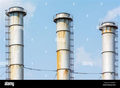 Factory Chimneys Of Coal Power Plant Against Blue Sky Stock Photo Alamy