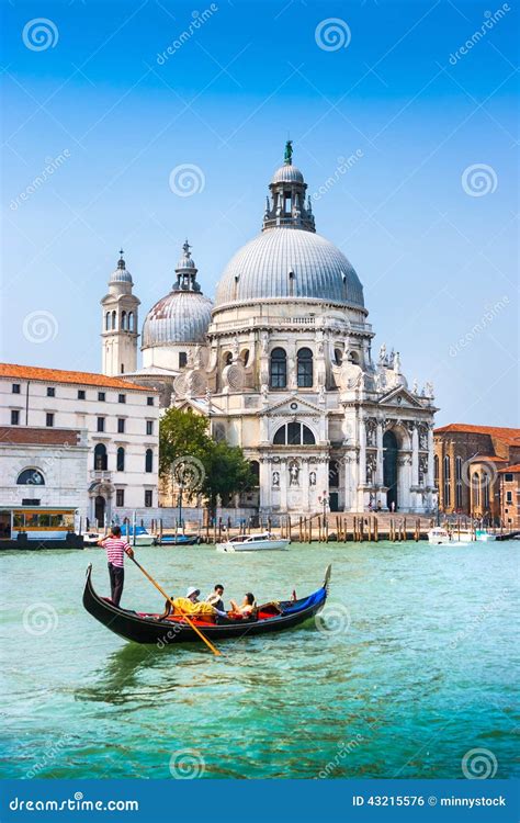 Traditional Gondola On Canal Grande With Basilica Di Santa Maria Della Salute Venice Italy