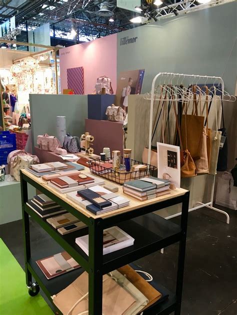 A Table With Many Items On It In Front Of A Store Display Area That Is